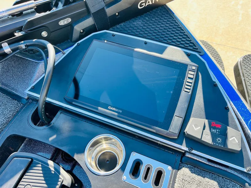 Slide: The Image of 2025 Ranger Z520R Cup-Equipped boat dashboard with Garmin display and controls. - 12