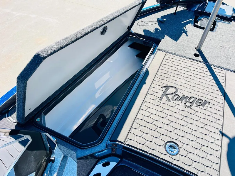 Slide: The Image of 2025 Ranger Z520R Cup-Equipped boat storage compartment with open lid, showcasing interior space. - 14