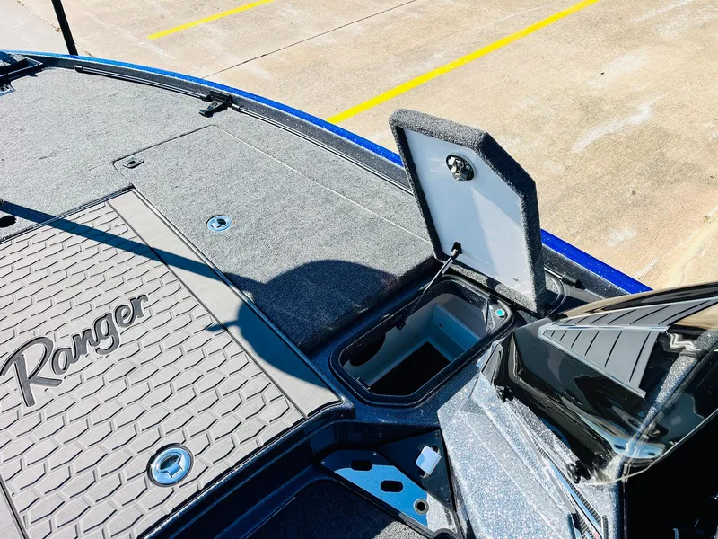 Slide: The Image of 2025 Ranger Z520R Cup-Equipped boat deck with open storage compartment. - 20