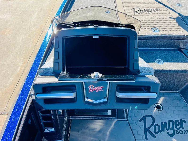 Slide: The Image of 2025 Ranger Z520R Cup-Equipped boat dashboard with storage compartments and logo. - 30