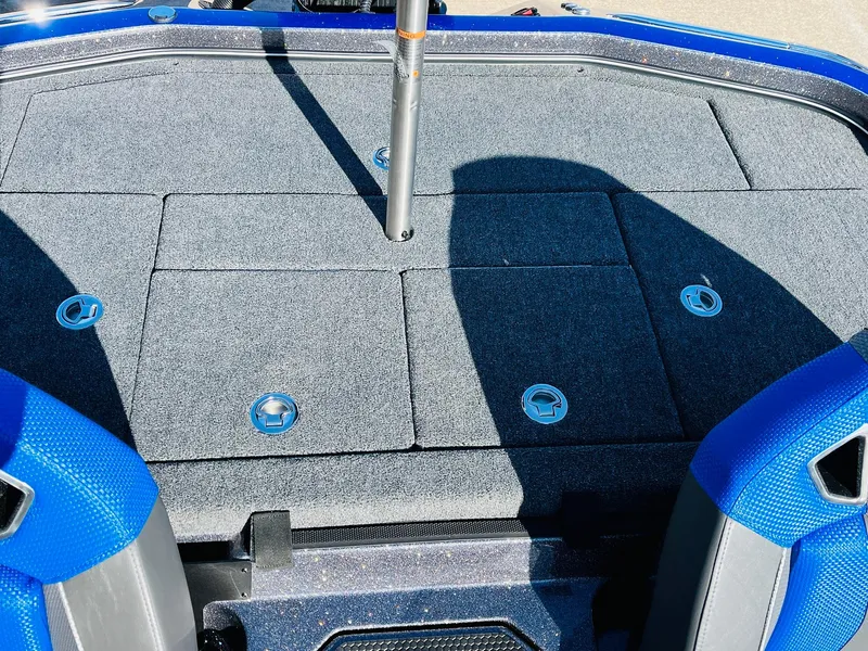 Slide: The Image of 2025 Ranger Z520R Cup-Equipped boat deck with storage compartments and blue accents. - 38