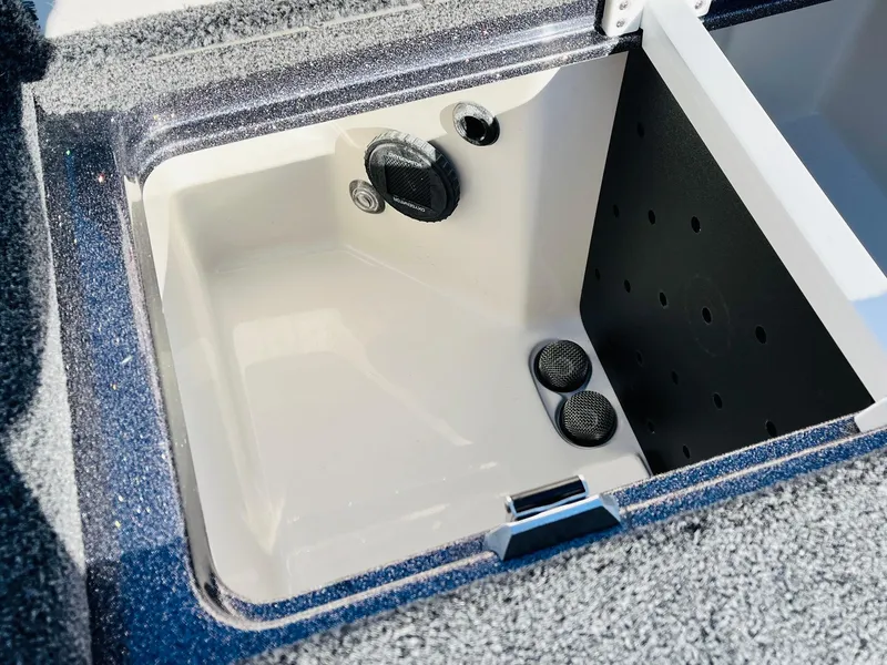 Slide: The Image of 2025 Ranger Z520R Cup-Equipped boat storage compartment with drainage and textured interior. - 40