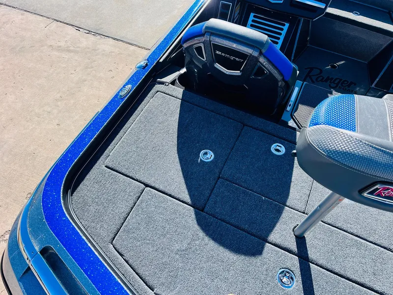 Slide: The Image of 2025 Ranger Z520R Cup-Equipped boat deck with seating and storage compartments. - 42
