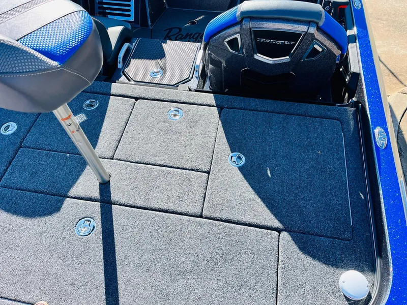 Slide: The Image of 2025 Ranger Z520R Cup-Equipped boat interior with seating and storage compartments. - 45