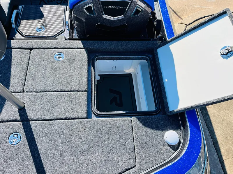 Slide: The Image of 2025 Ranger Z520R Cup-Equipped boat storage compartments with open hatch, showcasing interior design. - 46