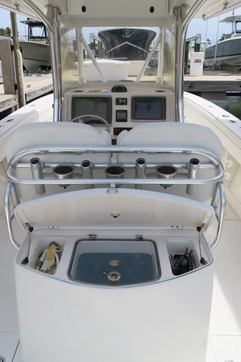 Slide: The Image of Center console of a 2013 Jupiter 34 boat with navigation equipment and rod holders. - 20