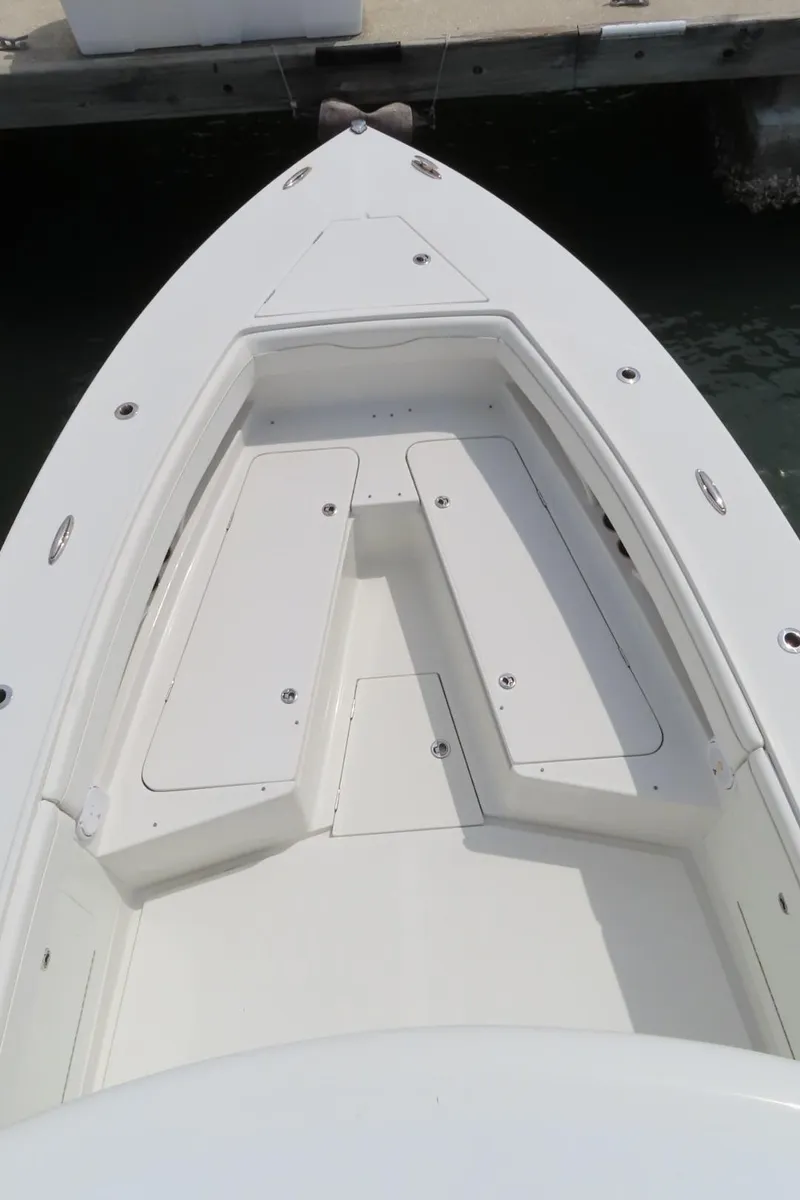 Slide: The Image of 2013 Jupiter 34 boat bow with seating, docked at marina. - 9