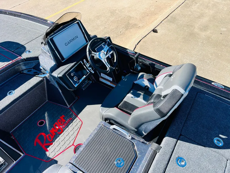 Slide: The Image of 2025 Ranger Z520R Cup-Equipped boat interior with Garmin display and steering wheel. - 31