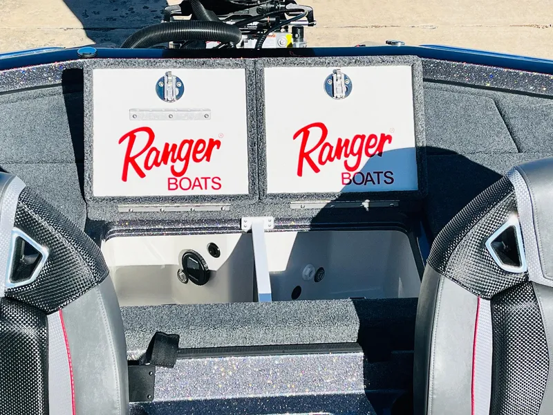Slide: The Image of 2025 Ranger Z520R Cup-Equipped boat interior with storage compartments and branded logos. - 38