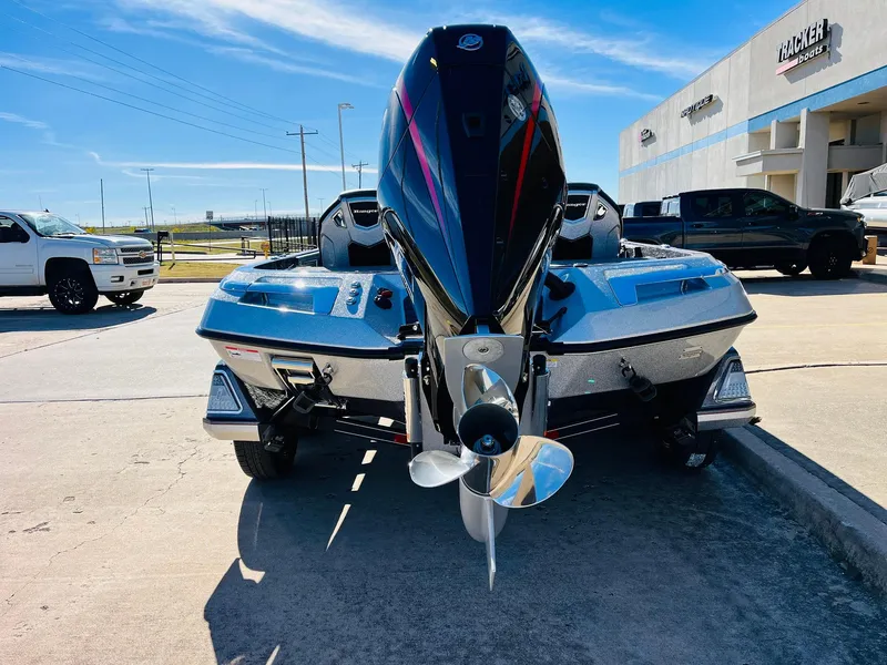 Slide: The Image of 2025 Ranger Z520R Cup-Equipped boat, rear view, parked outdoors on a sunny day. - 5