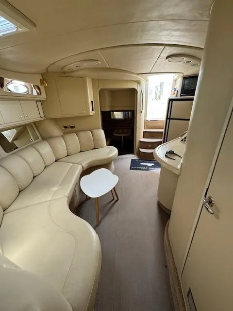 Slide: The Image of Luxurious interior of 1998 Sea Ray 400 Sundancer yacht with cream leather seating. - 24
