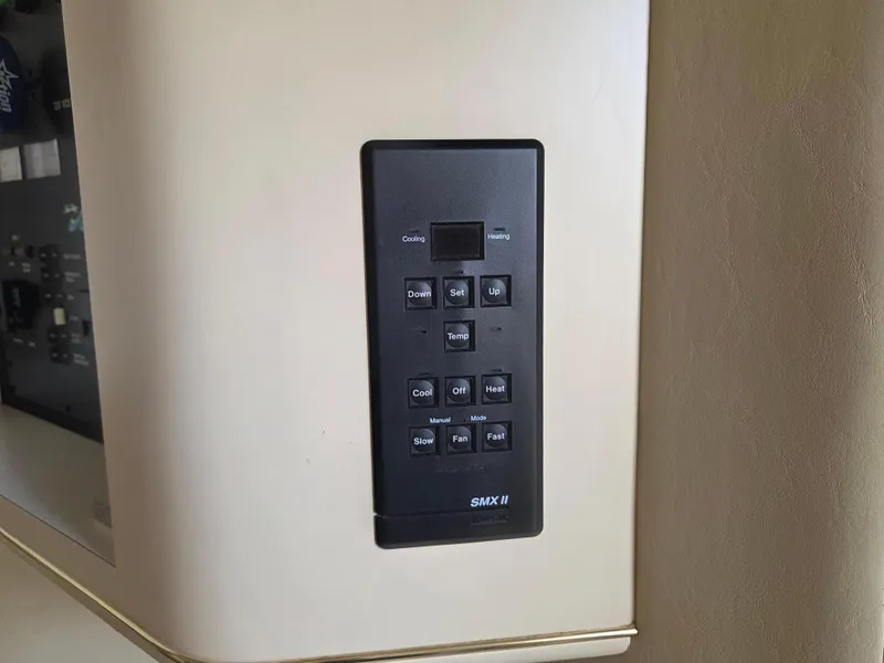 Slide: The Image of Control panel on a 1998 Sea Ray 400 Sundancer yacht interior. - 39