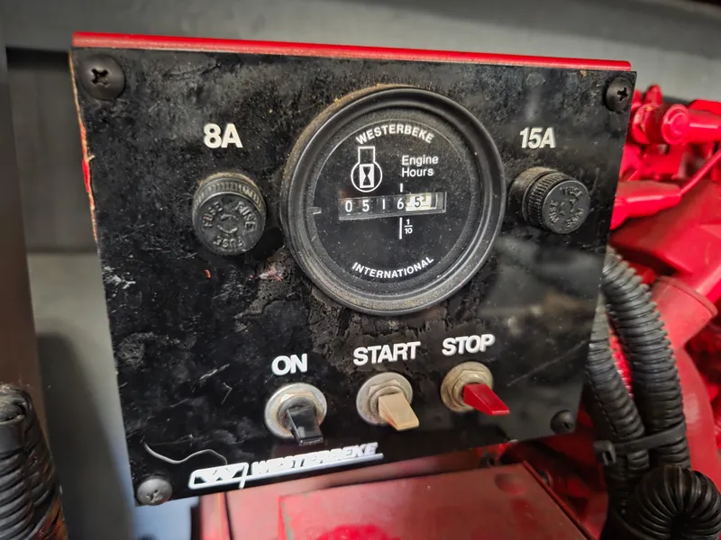 Slide: The Image of Control panel of a 1998 Sea Ray 400 Sundancer with engine hour meter. - 42