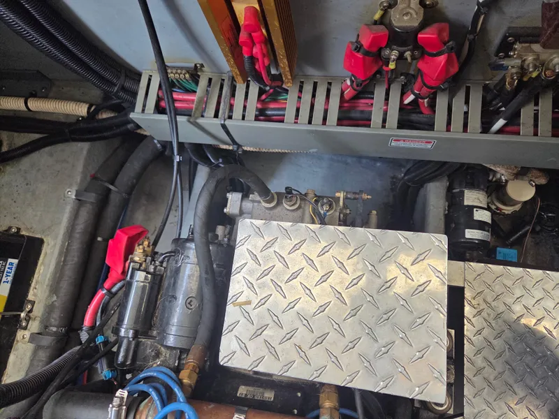 Slide: The Image of Engine room of a 1998 Sea Ray 400 Sundancer with visible wiring and components. - 44