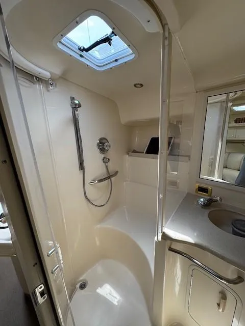 Slide: The Image of Bathroom interior of 1998 Sea Ray 400 Sundancer yacht with shower and skylight. - 50
