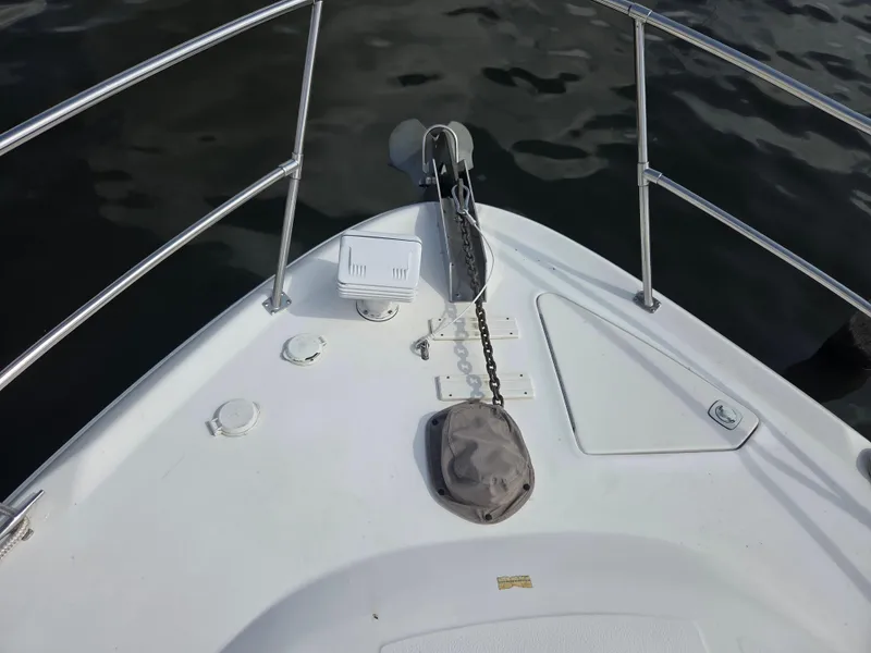 Slide: The Image of Bow of 1998 Sea Ray 400 Sundancer with anchor chain and railing. - 7