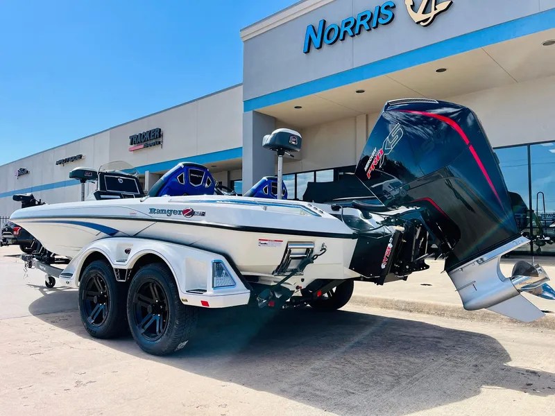 Slide: The Image of 2025 Ranger Z521R Cup-Equipped boat parked outside dealership, showcasing sleek design and powerful engine. - 10