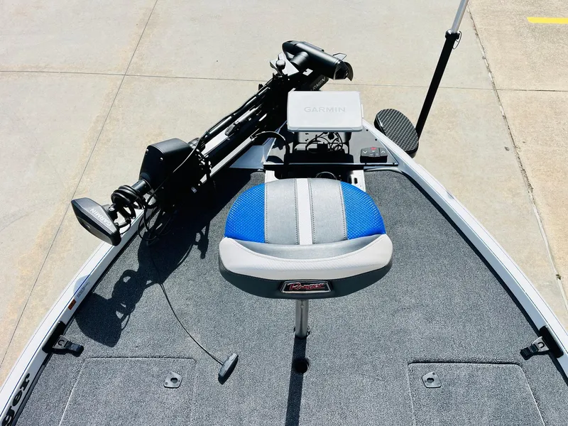 Slide: The Image of 2025 Ranger Z521R Cup-Equipped boat with blue and gray seating, featuring advanced navigation equipment. - 13