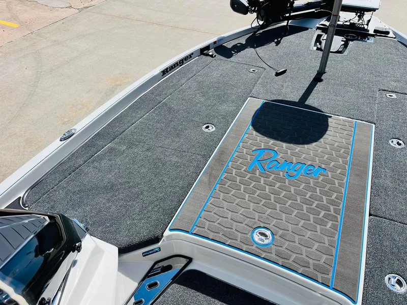 Slide: The Image of 2025 Ranger Z521R Cup-Equipped boat deck with logo and textured surface. - 17