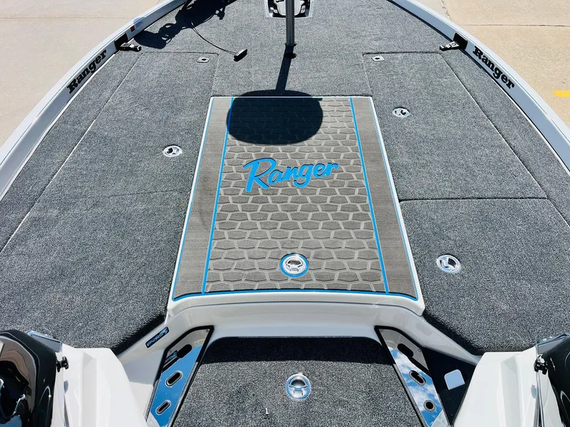 Slide: The Image of 2025 Ranger Z521R Cup-Equipped boat deck with logo and textured surface. - 18