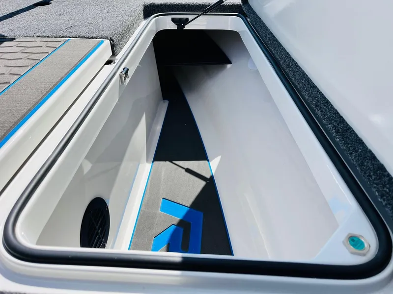 Slide: The Image of Open storage compartment in 2025 Ranger Z521R Cup-Equipped boat, featuring sleek design and ample space. - 26