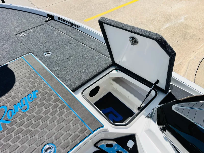 Slide: The Image of 2025 Ranger Z521R Cup-Equipped boat with open storage compartment on deck. - 27