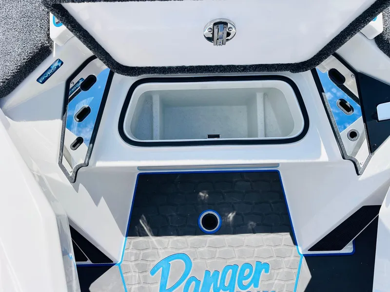 Slide: The Image of 2025 Ranger Z521R Cup-Equipped boat interior with storage compartment and blue accents. - 31