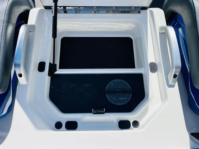 Slide: The Image of 2025 Ranger Z521R Cup-Equipped boat storage compartment with handles and drainage system. - 46