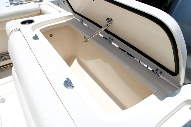 Slide: The Image of Open storage compartment on 2019 Grady-White Freedom 275 boat. - 11