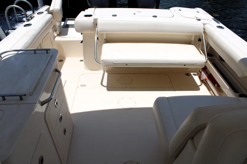 Slide: The Image of 2019 Grady-White Freedom 275 boat interior with seating and storage compartments. - 17