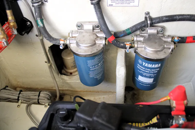 Slide: The Image of Fuel filters in a 2019 Grady-White Freedom 275 boat engine compartment. - 18