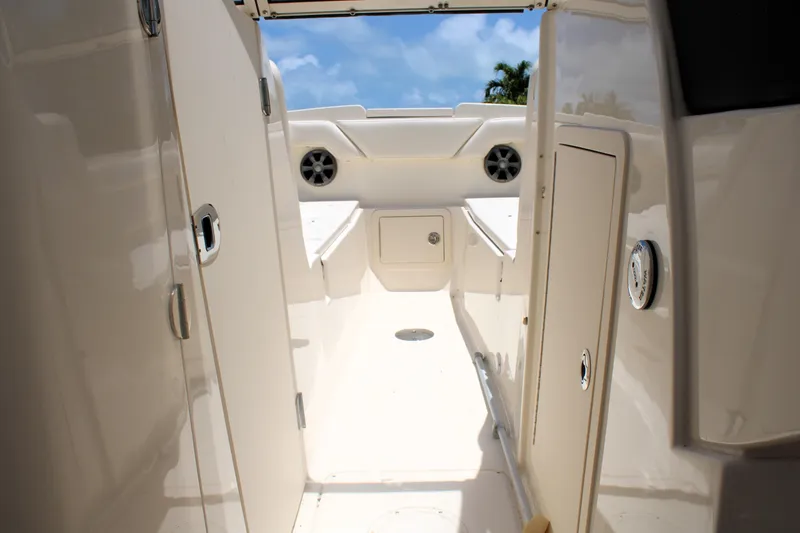 Slide: The Image of 2019 Grady-White Freedom 275 boat interior with storage compartments and speakers. - 35
