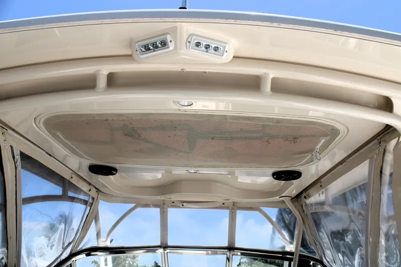 Slide: The Image of 2019 Grady-White Freedom 275 boat interior ceiling with lights and clear panels. - 36