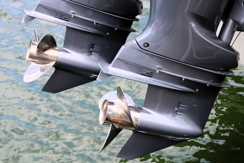 Slide: The Image of Twin outboard motors on a 2019 Grady-White Freedom 275 boat, above water. - 6