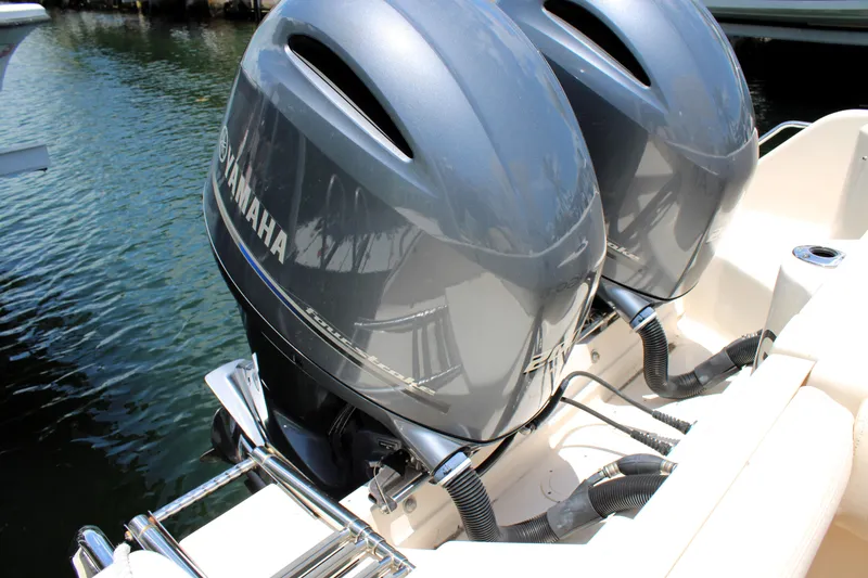 Slide: The Image of Twin Yamaha outboard engines on a 2019 Grady-White Freedom 275 boat. - 7