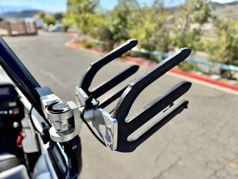 Slide: The Image of Wakeboard rack on a 2021 Moomba Craz boat, parked outdoors. - 12