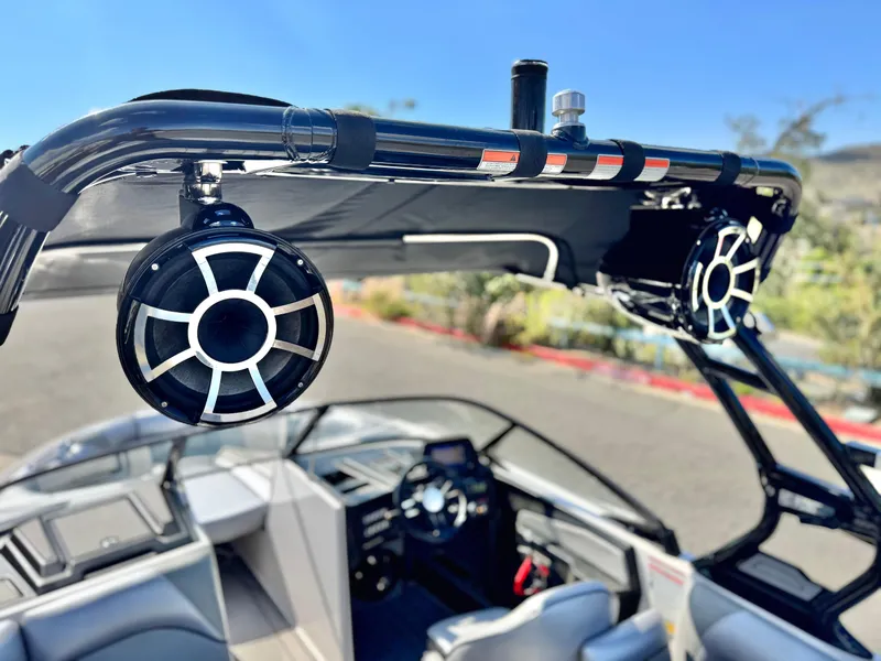 Slide: The Image of 2021 Moomba Craz boat with mounted speakers and sleek interior design. - 13