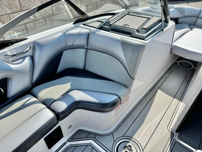 Slide: The Image of 2021 Moomba Craz boat interior with sleek gray seating and modern design. - 22