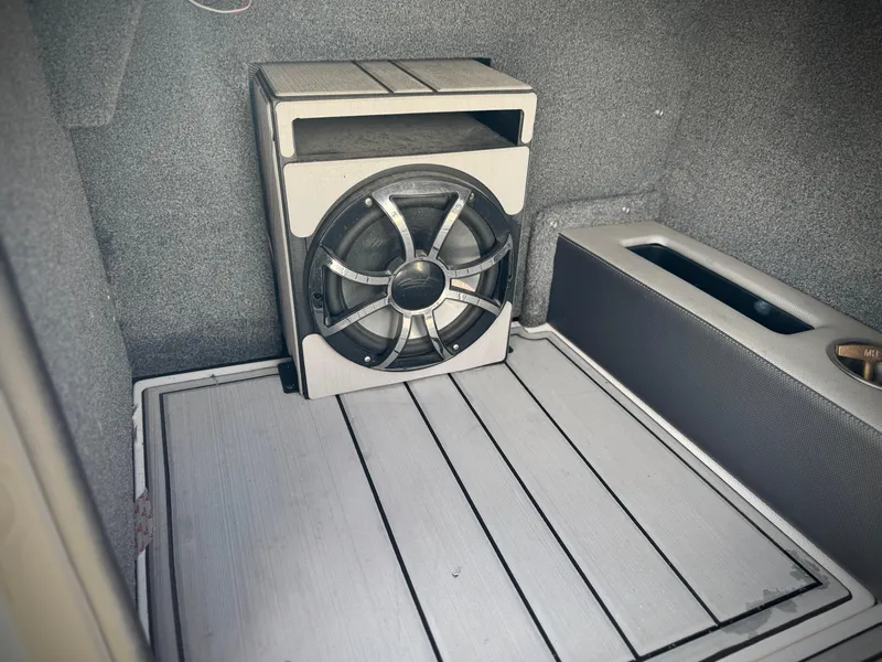 Slide: The Image of 2021 Moomba Craz boat interior with subwoofer and storage compartment. - 35