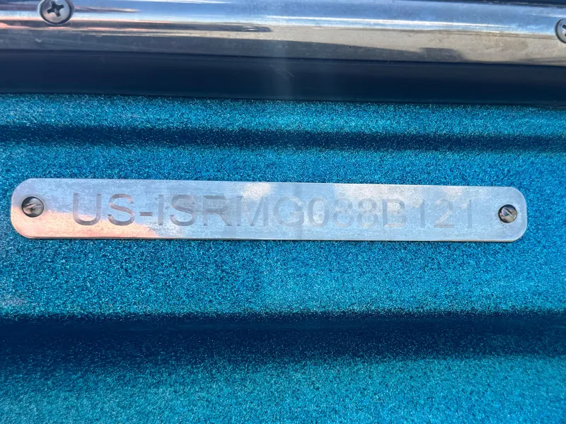 Slide: The Image of 2021 Moomba Craz boat identification plate with serial number on blue surface. - 37