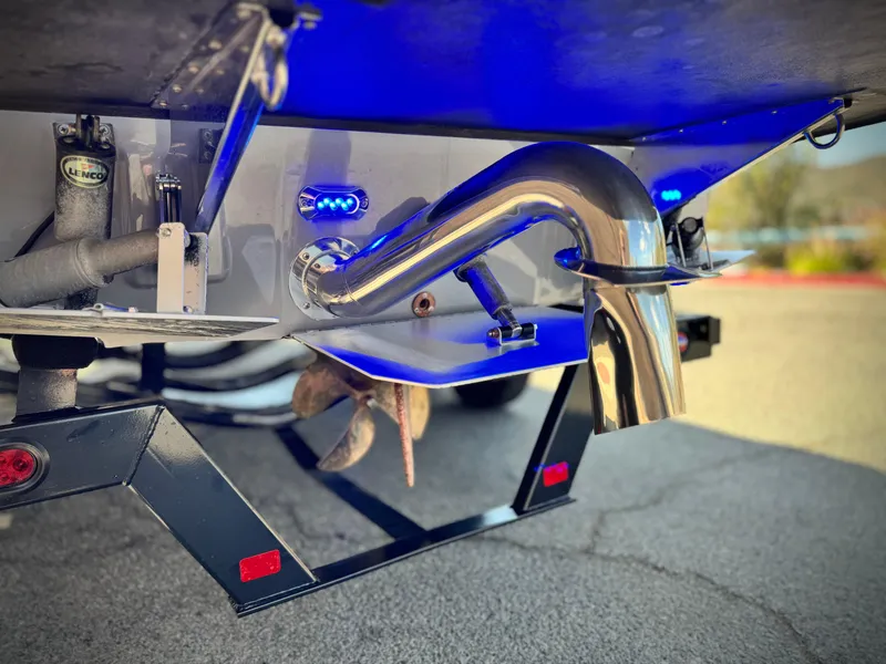 Slide: The Image of 2021 Moomba Craz boat exhaust system with blue lighting and trailer. - 7