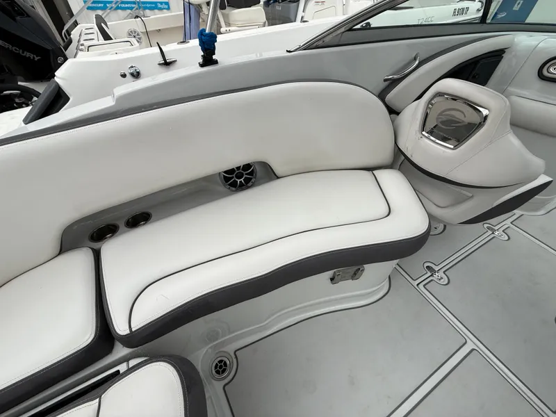 Slide: The Image of 2019 Crownline Eclipse E255 XS boat interior with white seating and modern design. - 26