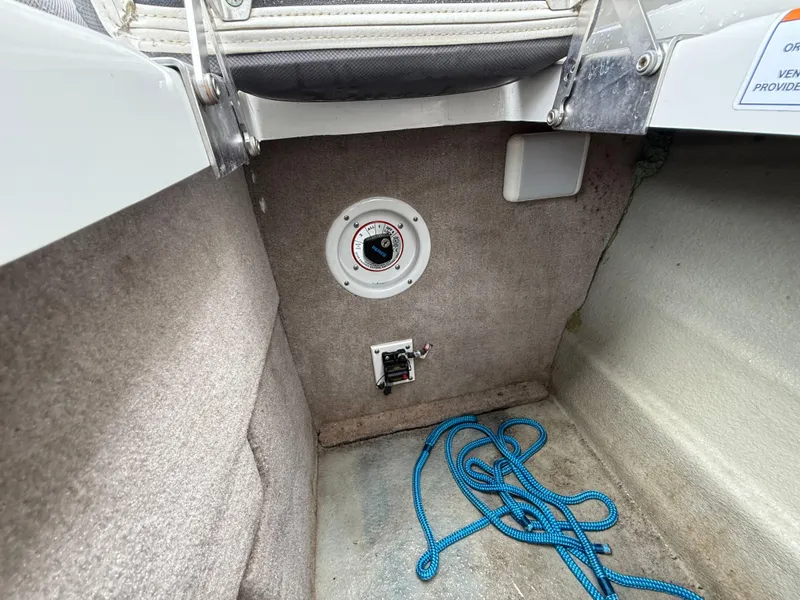 Slide: The Image of 2019 Crownline Eclipse E255 XS boat interior with blue rope and control panel. - 28