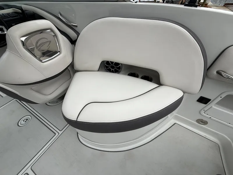 Slide: The Image of 2019 Crownline Eclipse E255 XS boat interior with white and gray seating. - 29