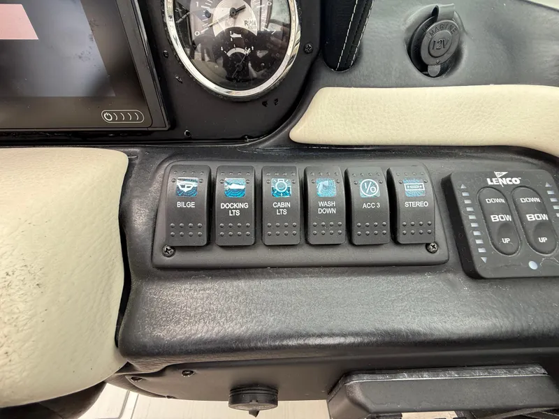Slide: The Image of Control panel of 2019 Crownline Eclipse E255 XS boat with labeled switches. - 39