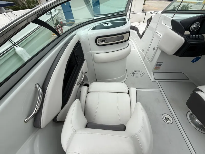 Slide: The Image of 2019 Crownline Eclipse E255 XS boat interior with white seating and modern design. - 41