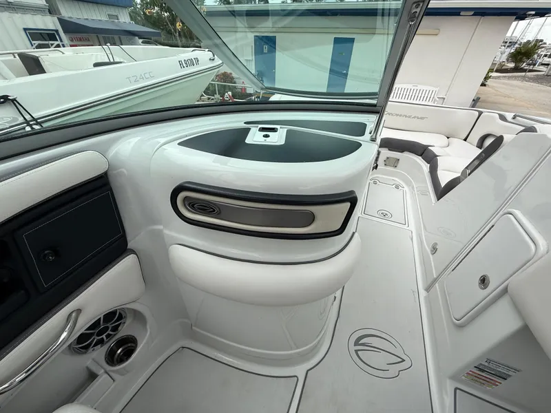 Slide: The Image of 2019 Crownline Eclipse E255 XS boat interior with sleek seating and modern dashboard. - 44