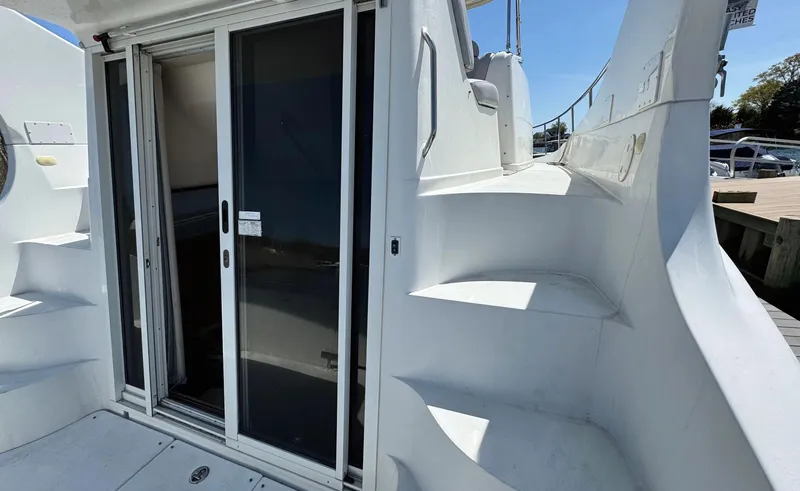 Slide: The Image of 2008 Carver 36 Mariner yacht with sliding glass door and exterior stairs. - 12