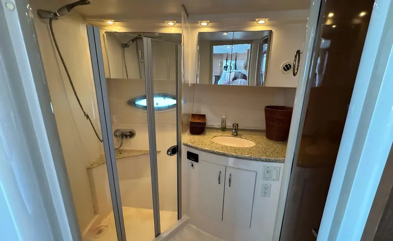 Slide: The Image of 2008 Carver 36 Mariner bathroom with shower, sink, and mirror. - 27