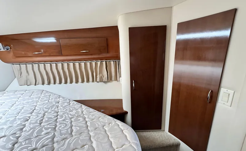 Slide: The Image of Interior of 2008 Carver 36 Mariner with wood cabinets and bed. - 31